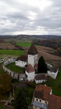 The beauty of autumn with this captivating drone footage of Hosman Fortified Church in Transylvania, Romania.