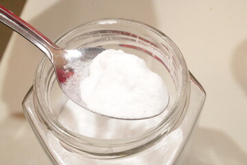 One spoonful of salt for cooking. white salt. salt for cooking