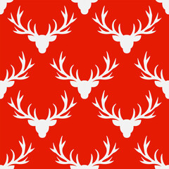 seamless pattern with white silhouettes of Reindeer heads with horns on a red background.
