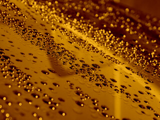 Beautiful Golden Drops On Glossy Surface With Selective Focus Stock Photo For Liquid Gold Backgrounds 
