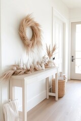Christmas decorations with pampas grass and white trees on console table in hallway
