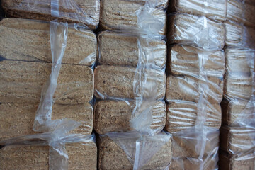 Organic pressed sawdust fuel briquettes