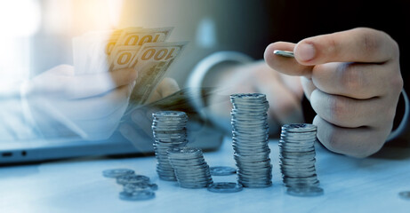 Businessman hand making stack of coins. Finance concept, saving money, investment development,...