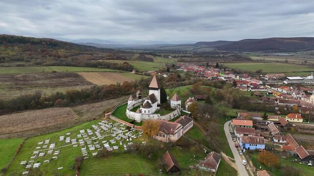 Experience the grandeur of Hosman Fortified Church in Transylvania, Romania, with this stunning drone footage.