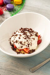 Top view of Strawberry magnolia dessert in white porcelain bowl