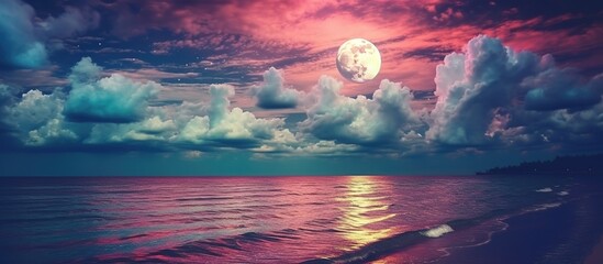 Super moon. Colorful sky with cloud and bright full moon over seascape in the evening