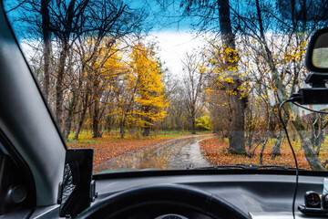 View of wet road through car windshield