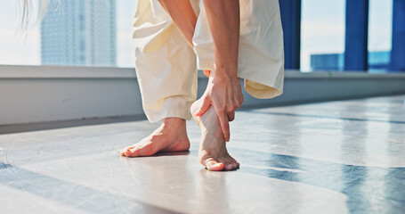 Injury, legs and dancer in studio, hurt and fracture on ankle, joint pain and accident for person....
