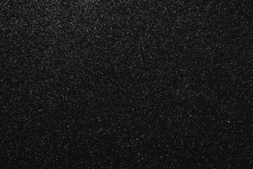 Shiny black glitter texture background