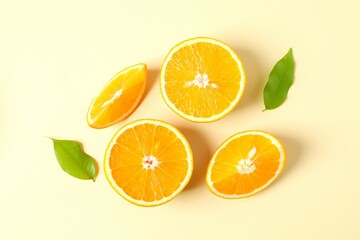 Fresh orange citrus fruit with leaves on colored background