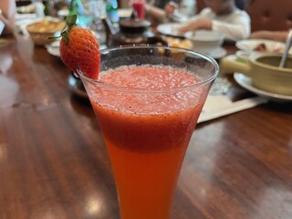 Refreshing Strawberry Smoothie in Elegant Glass at a Luxurious Restaurant Setting