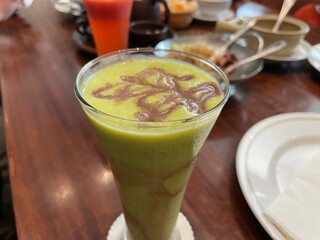 Delicious Green Smoothie with Chocolate Drizzle A Refreshing Beverage Perfect for a Healthy Treat