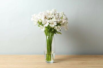 Beautiful white alstroemeria 
in a vase on the table