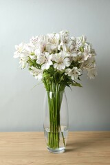 Beautiful white alstroemeria 
in a vase on the table