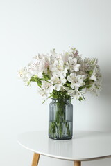 Beautiful white alstroemeria 
in a vase on the table