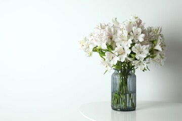 Beautiful white alstroemeria 
in a vase on the table