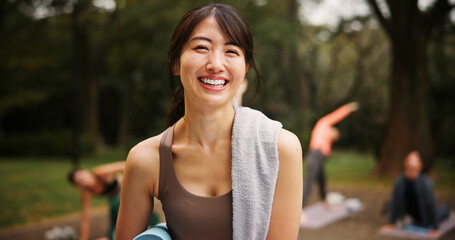 Outdoor, woman and happy on portrait for yoga session with mat for health, self care and wellbeing...
