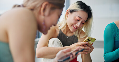 Cellphone, friends and women in dance studio with networking, communication or browsing social...