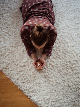 Woman On the Floor Holding Teddy Fox