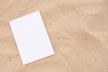 blank magazine mockup on sandy beach © dark_blade