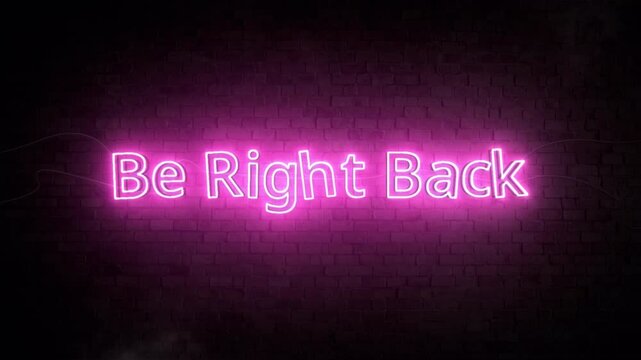Pink Neon Sign Saying 'Be Right Back' on Dark Brick Wall Background