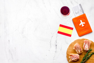 Travel to Spain. Passport and airplane tickets with traditional Spanish meal