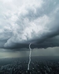 A dramatic thunderstorm captures lightning striking down amidst dark, ominous clouds over a cityscape, creating a powerful atmospheric scene.