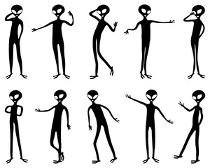 Black silhouettes of aliens  on a white background