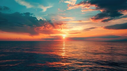 Fototapeta premium Sunset View Over Sea: Vibrant Sky and Ocean Beauty