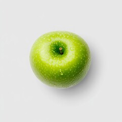Single green apple with water droplets on a white background.
