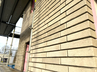 Obraz premium Close up of modern beige grey bricks walls at a construction site, building a house concept 