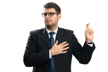 Dishonest businessman making fake oath gesture touching chest