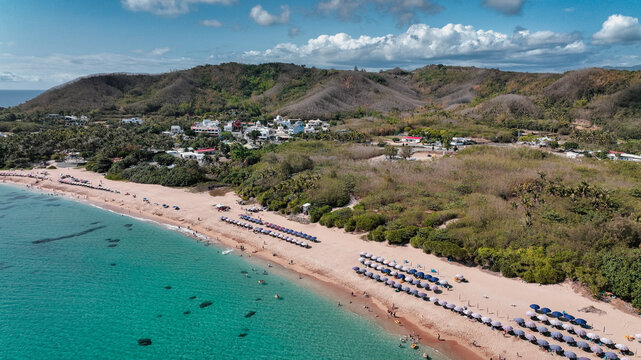 Aerial view of Kenting Baishawan beach in Taiwan with clear waters and lush hills