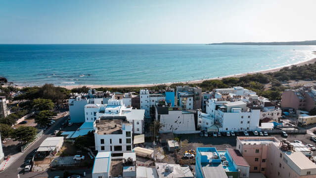 Aerial view of coastal buildings near Baishawan beach in Kenting Taiwan under bright sunny sky