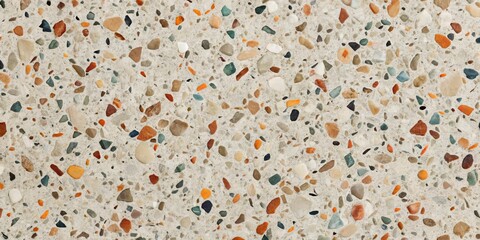 Textured Surface of Colorful Pebbles Embedded in Light Gray Cement