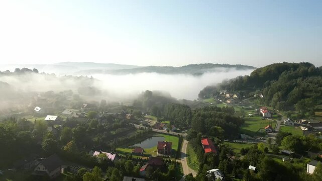 The village of Brodnica Dolna and surrounding nature in Kashubia shrouded in fog. Poland.