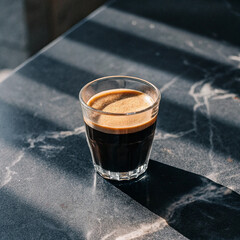 Closeup glass of americano hot coffee isolated on white background