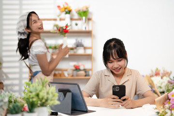Asia people young woman SME owner happy smile enjoy open flower shop work at home office workspace. Loan money banking for online store seller. Girl power pride in sale order.