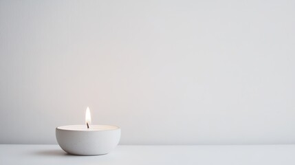 Minimalist white candle burning quietly, serene ambience