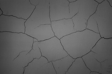 gray background, photo shows gray wall with cracks