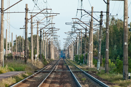 In the photo there is an electrified railway without trains