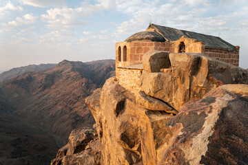 Beautiful sunrise on top of Mousa Mountain in Egypt, South Sinai. An ancient monastery on the top of Mount Moses, on the Sinai Peninsula