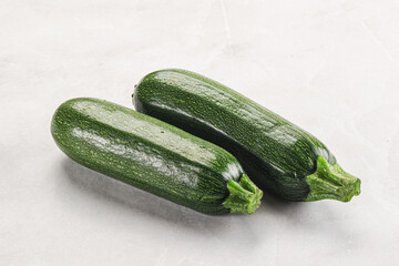 Raw green ripe zucchini vegetable
