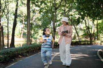 Friendly Walk in Park with Young Person with Dwarfism