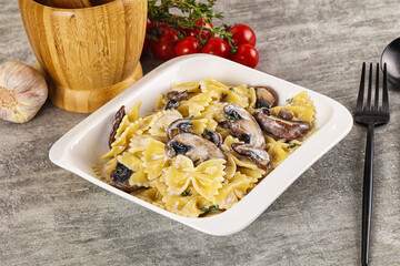 Italian cuisine - farfalle with mushrooms