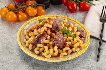 Italian pasta cellentani with anchovy