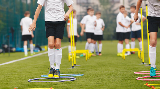 Football Soccer Skills. Soccer Training Session For Youth. Players Training on the Field. Soccer Obstacle Course. Grass Football Field. Coaching Soccer Gear Equipment for Field Training
