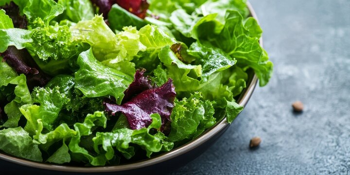 Olive green salad mix featuring fresh lettuce leaves creates a delightful vegetable dish, ideal for a healthy meal or snack. This olive green salad mix adds freshness to any table setting.