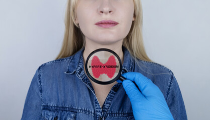 Thyroid disease - hyperthyroidism. The doctor examines the patient's thyroid gland with a diagnosis...
