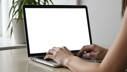 Woman using and typing on laptop with blank white screen. Mockup image blank white desktop screen